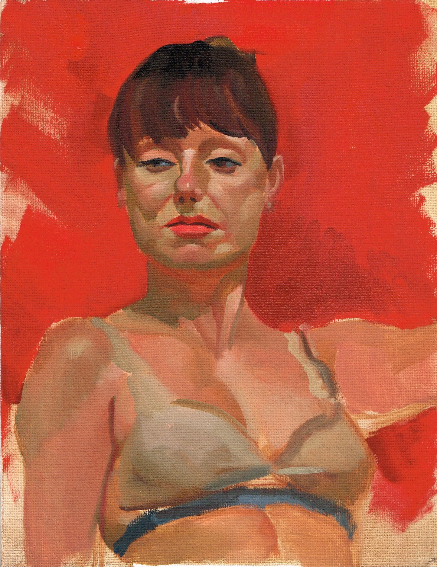 A Brunette woman behind a red background